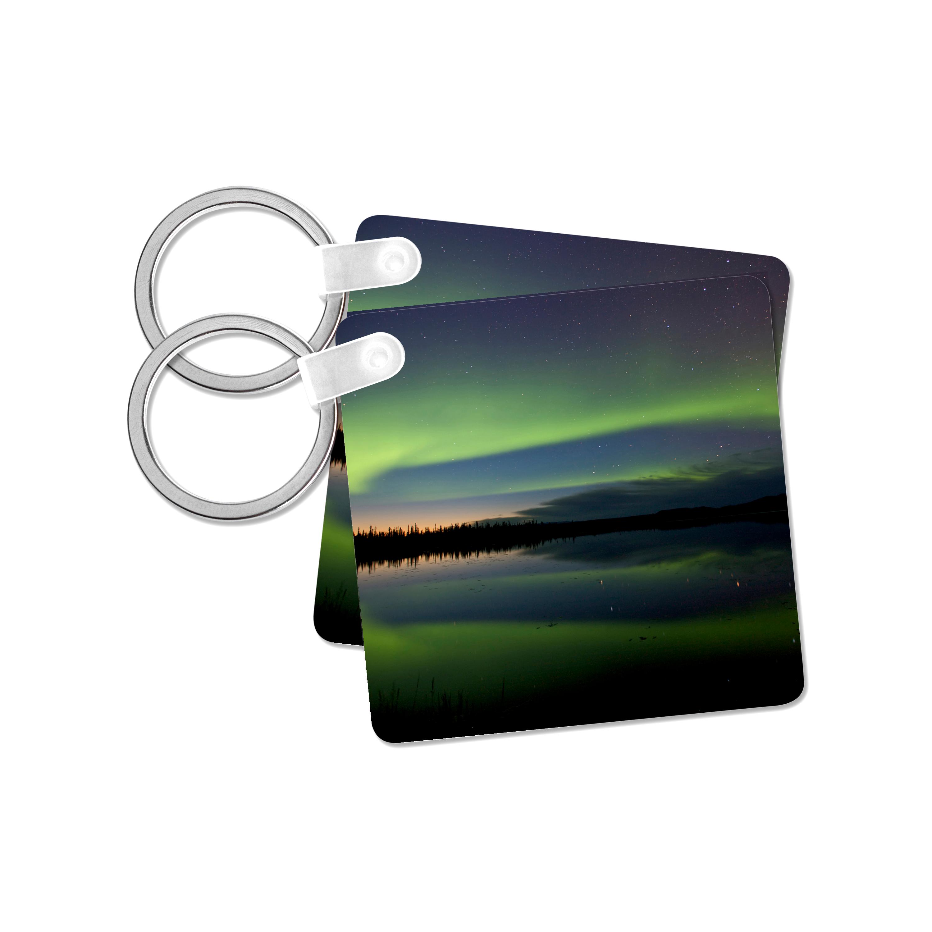 Key Chain - USA, Alaska, Bettles. Aurora borealis reflects in Vor Lake Waterlane. Northern Lights